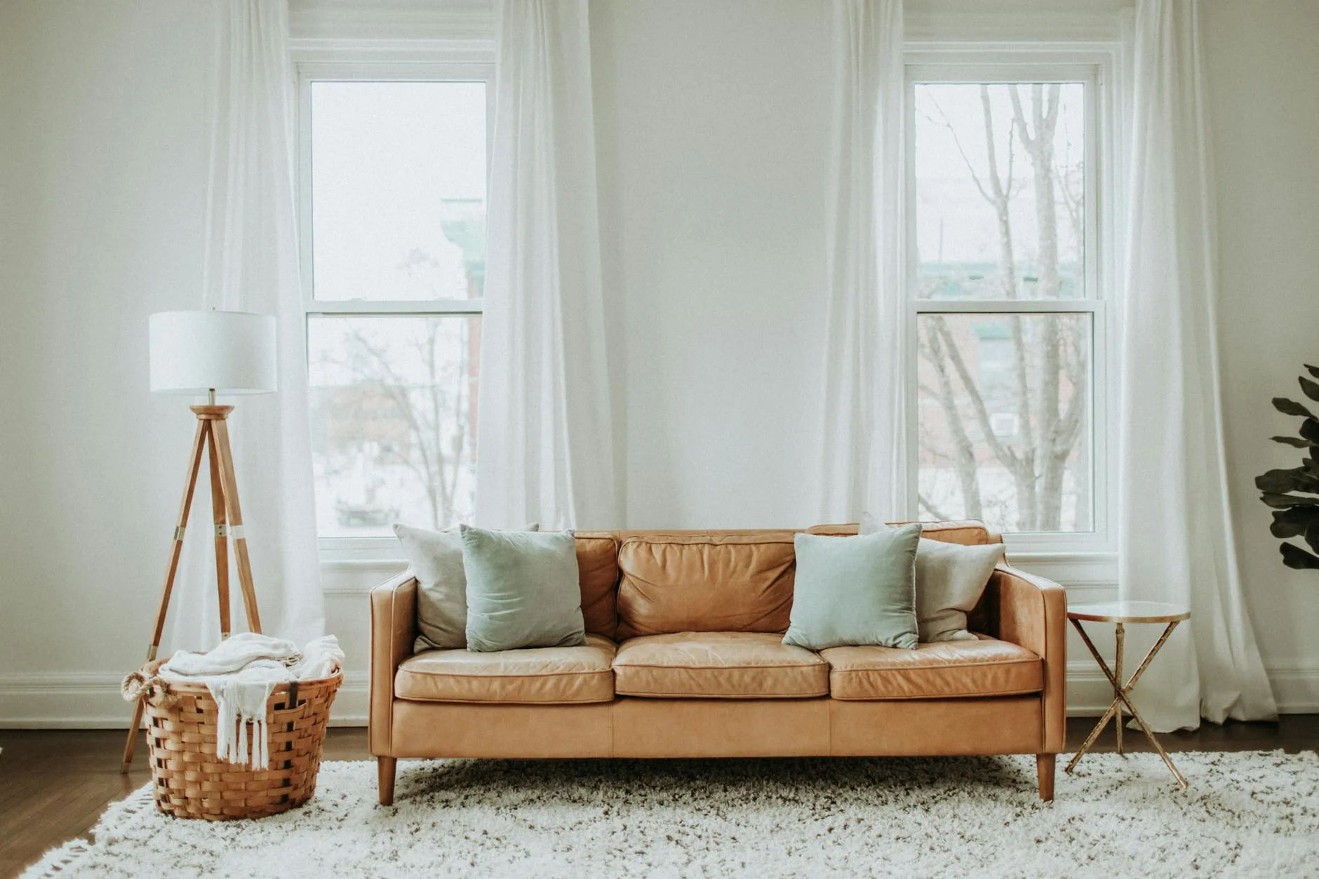 white and brown sofa chair near white window curtain. easy room upgrades.
