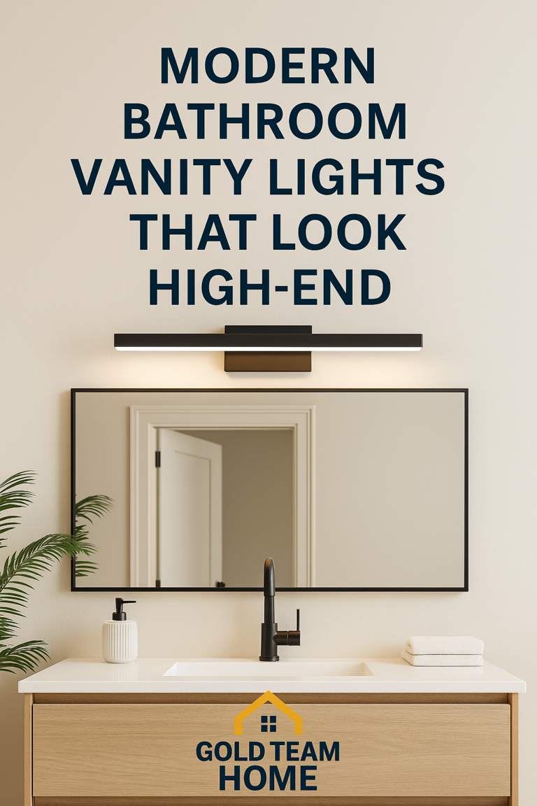 A modern bathroom vanity with a large mirror, warm lighting, and a sleek wall-mounted light fixture above. Overlay text reads “Best Bathroom Vanity Lights Under $120” with the Gold Team Home logo at the bottom.